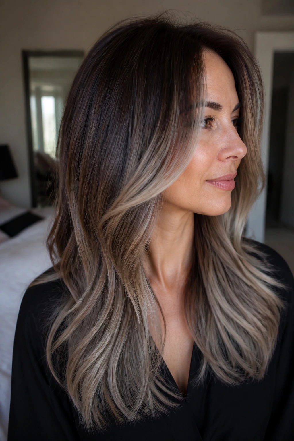 Real person with frosted brown fade and face-framing layers.