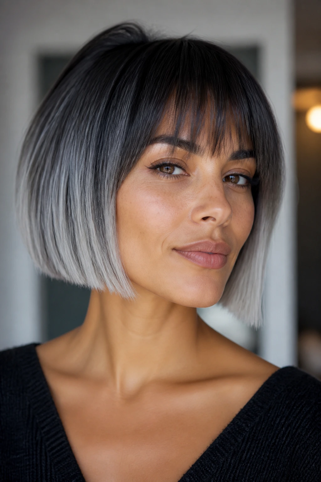 Close-up of a woman with a frost-edged French bob and blunt ends