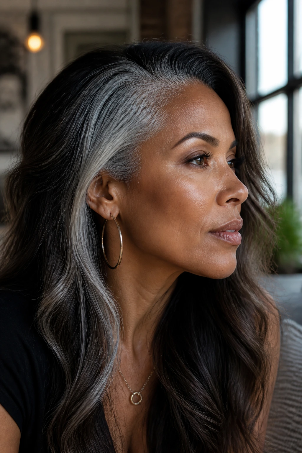 Portrait of a real woman showing frosted temple panels in gray-black hair