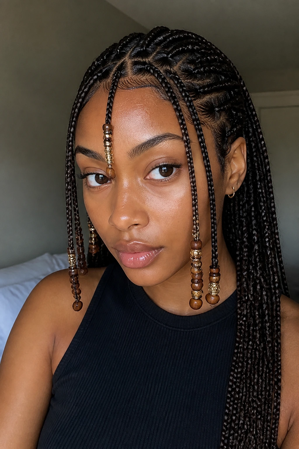 Real woman with Fulani-inspired braids and beads on the front
