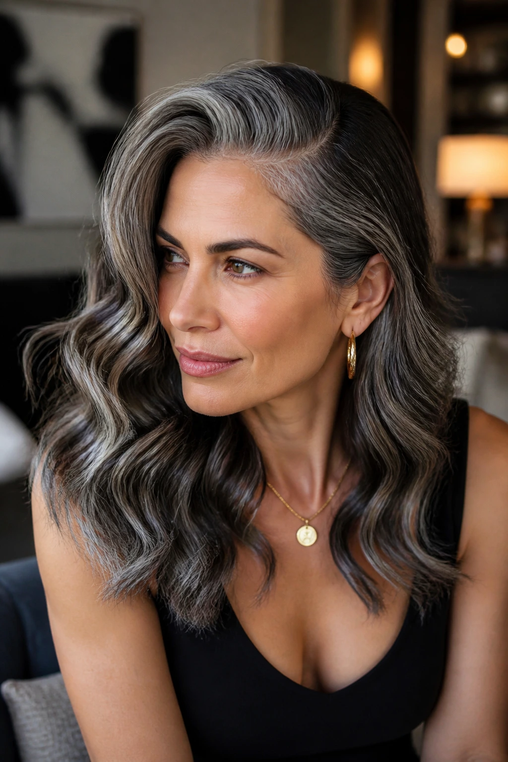 Close-up of a real woman with glamorous side-part waves and silver highlights