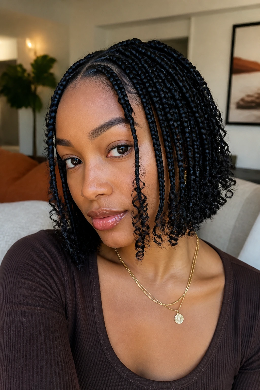 Goddess bob braids with loose ends framing the face on a real person