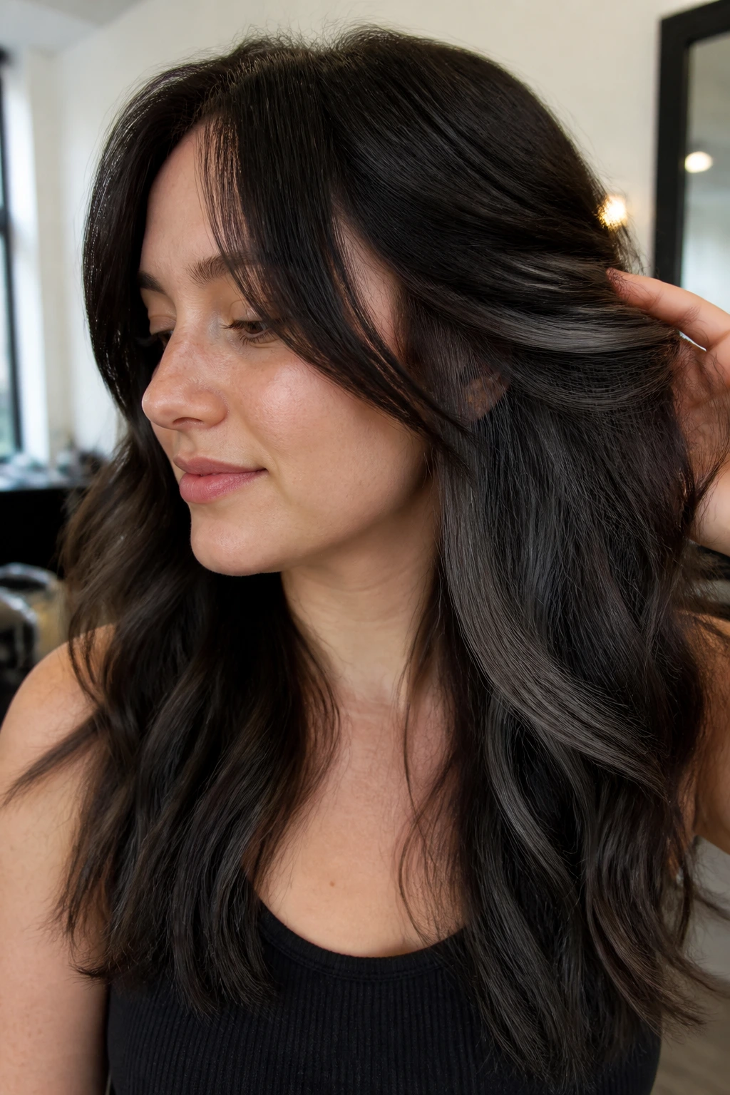Close-up hair showing graphite brown peekaboo panels under the top layer