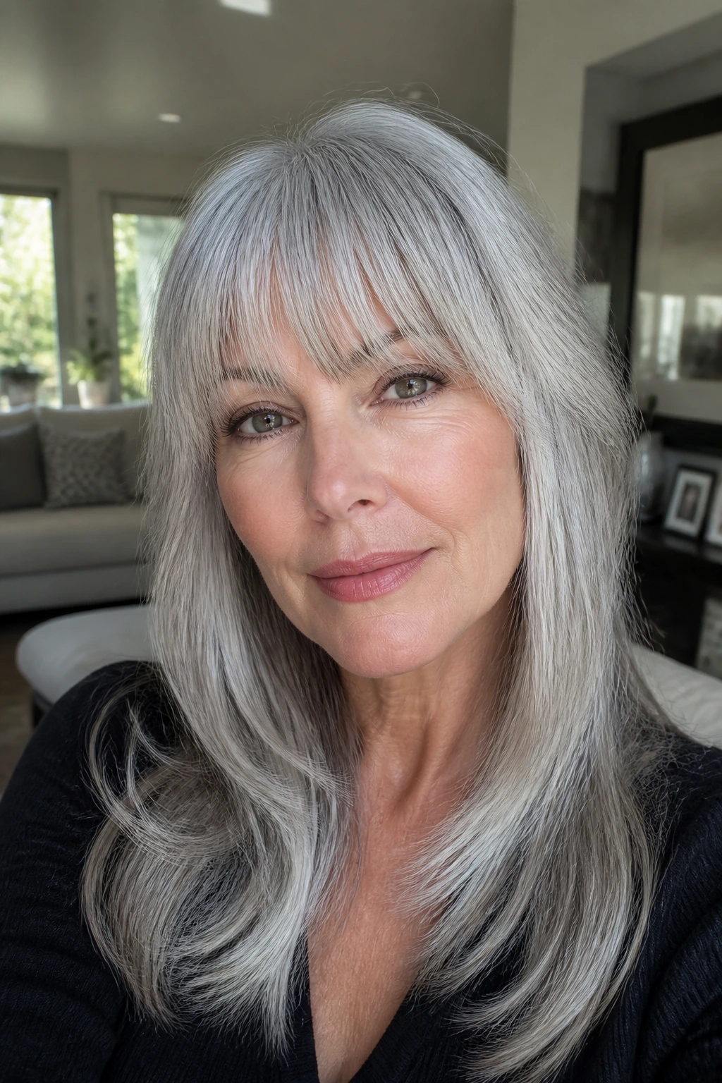 Close-up of a real woman with silver-gray fringe blending into hair