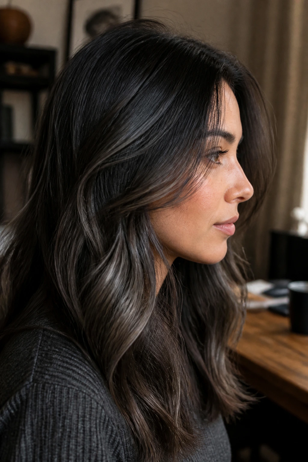 Side-profile close-up of brunette hair showing undertones and depth