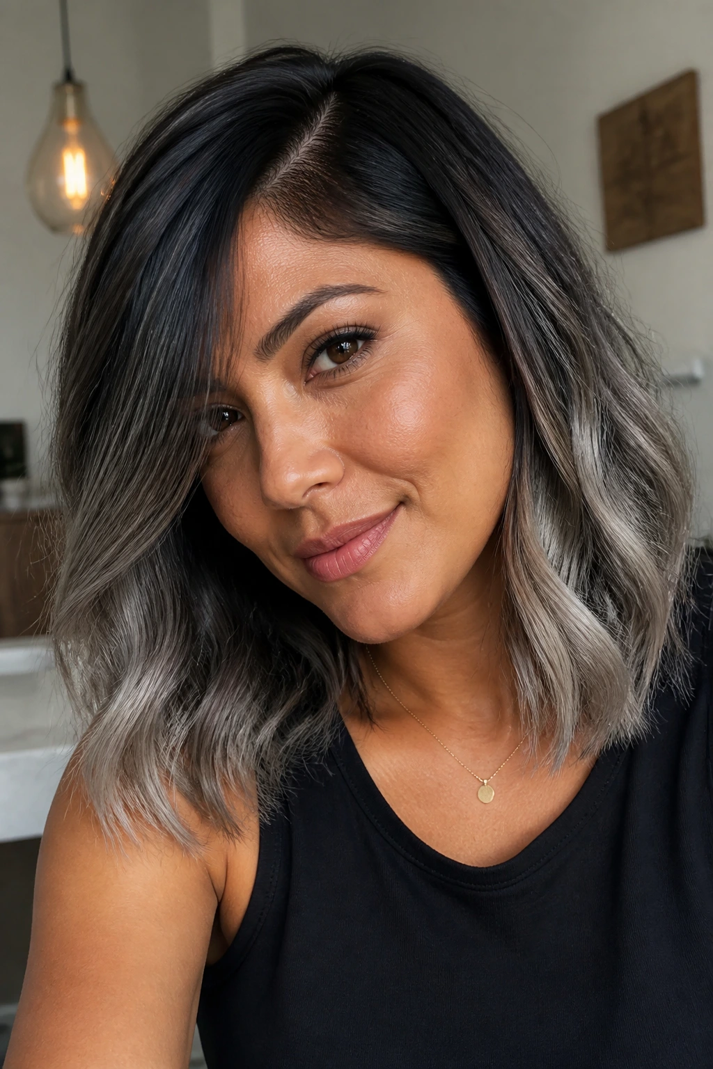 Side-parted shoulder-length hair with grey ends on a real person