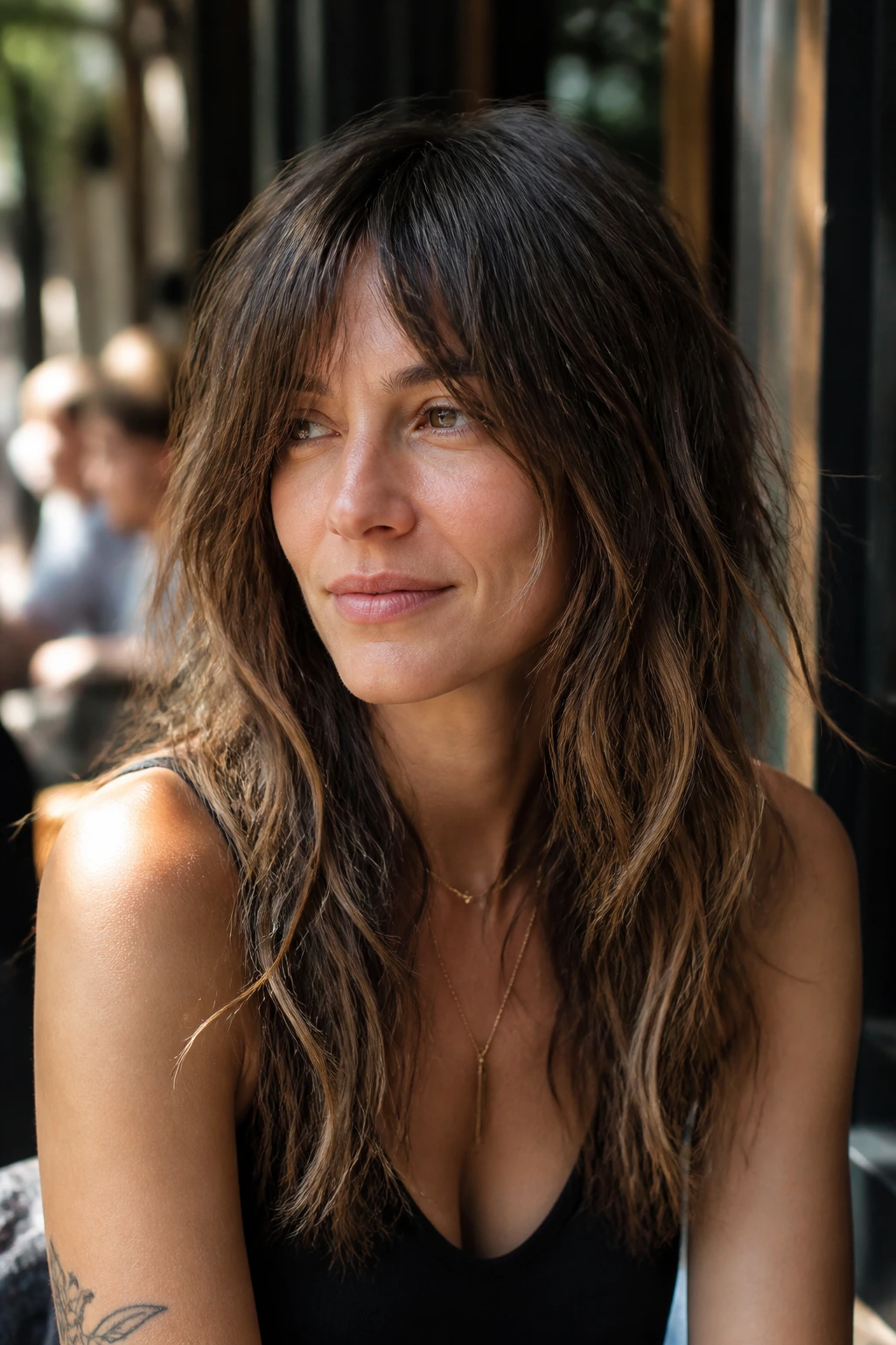 Portrait of a woman with grown-out shag layers and relaxed waves