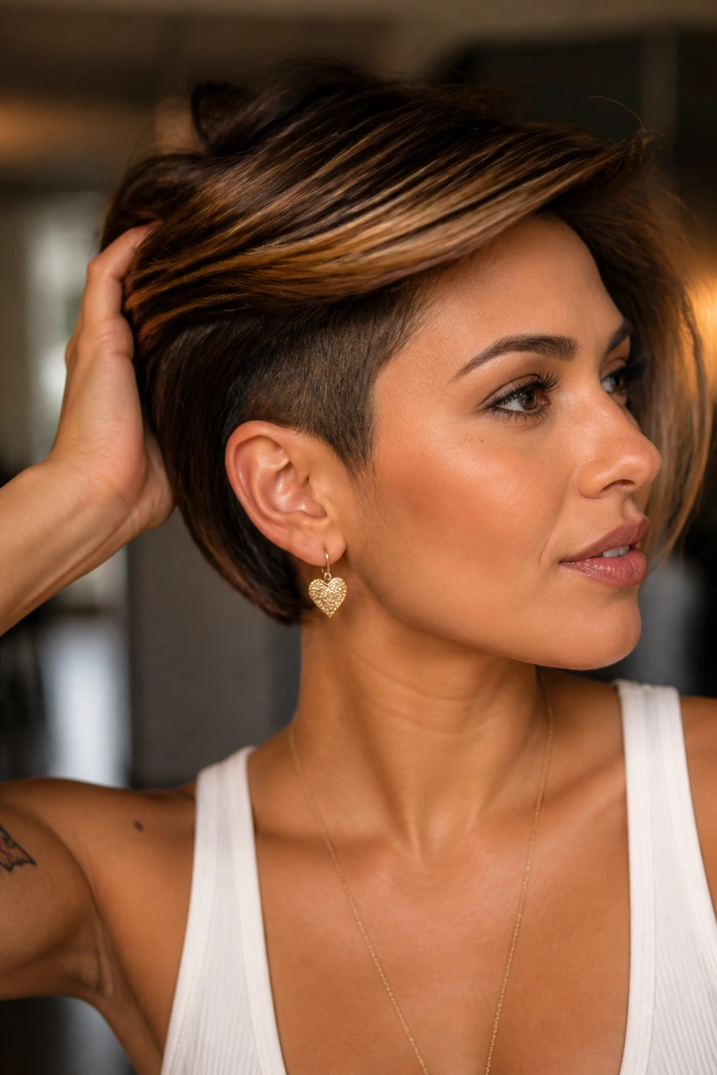 Close-up of real woman with hazelnut balayage and undercut bob