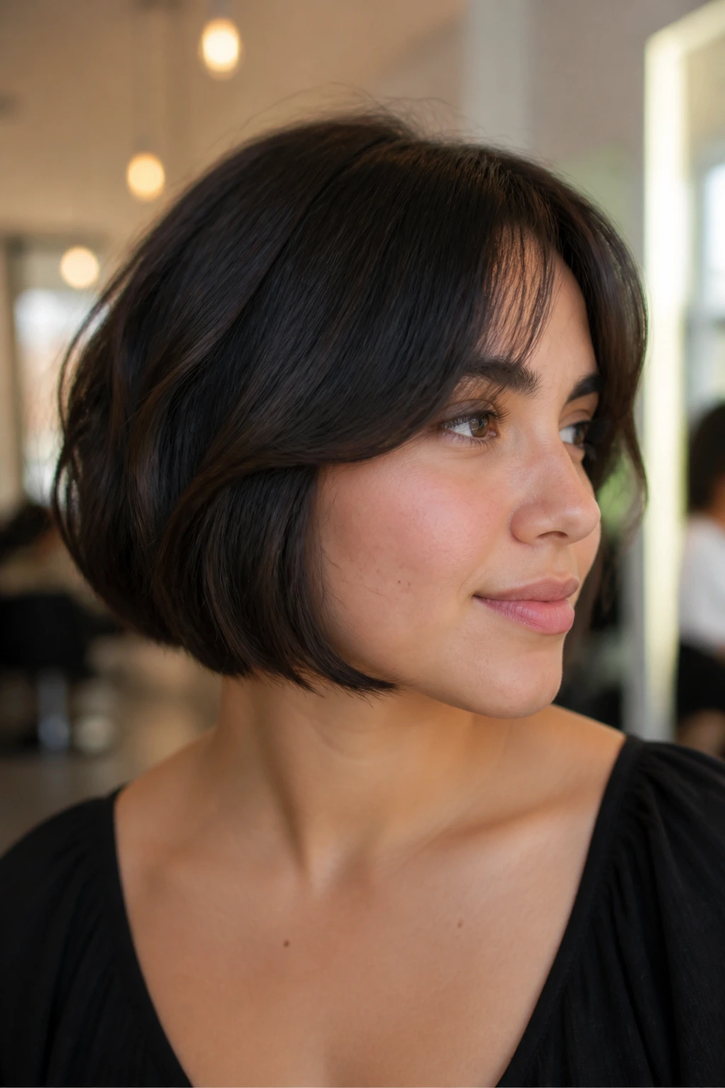 Close up portrait of a real woman with hidden-layer French bob in soft lighting
