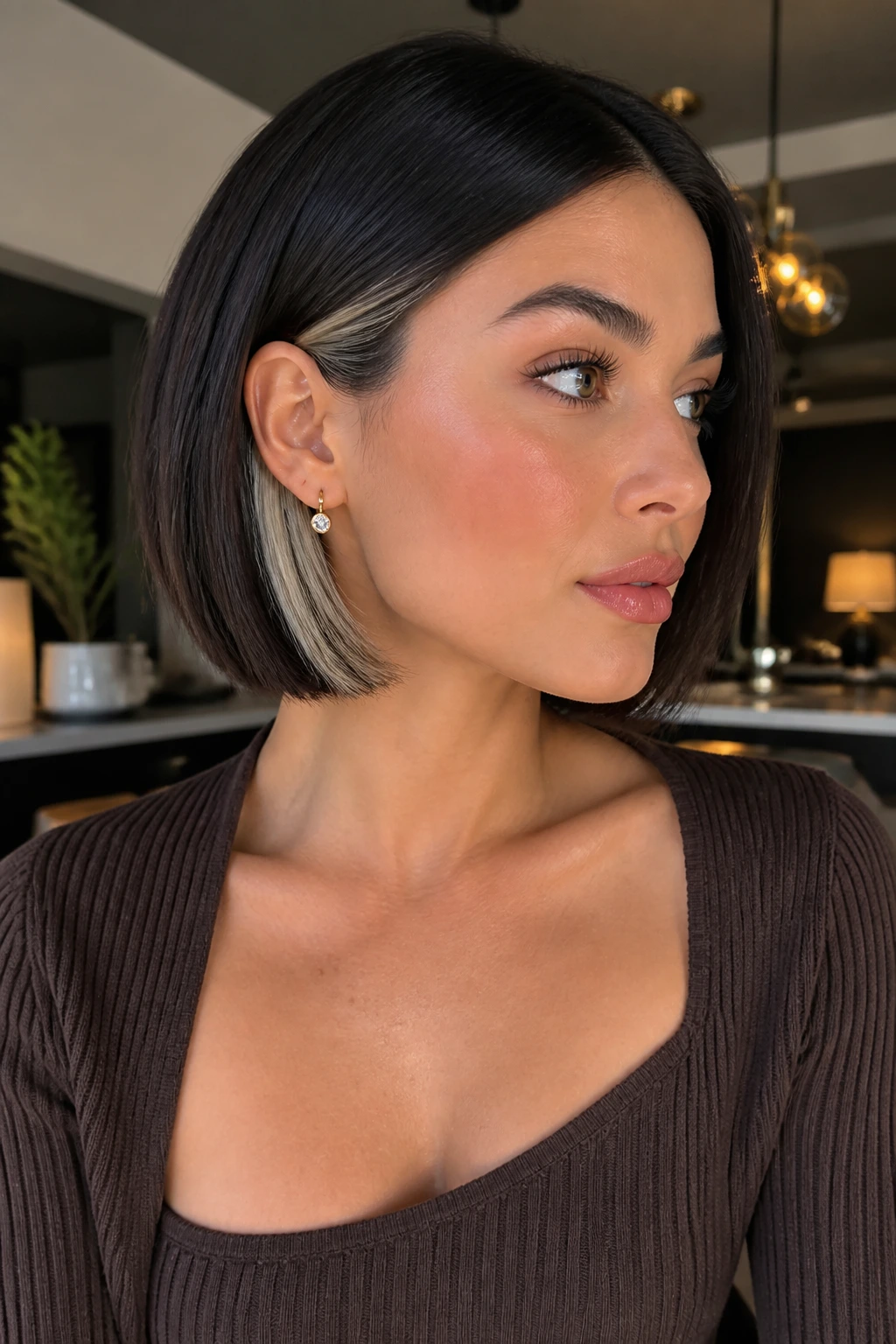 Sleek bob with icy peekaboo panels visible behind the ear