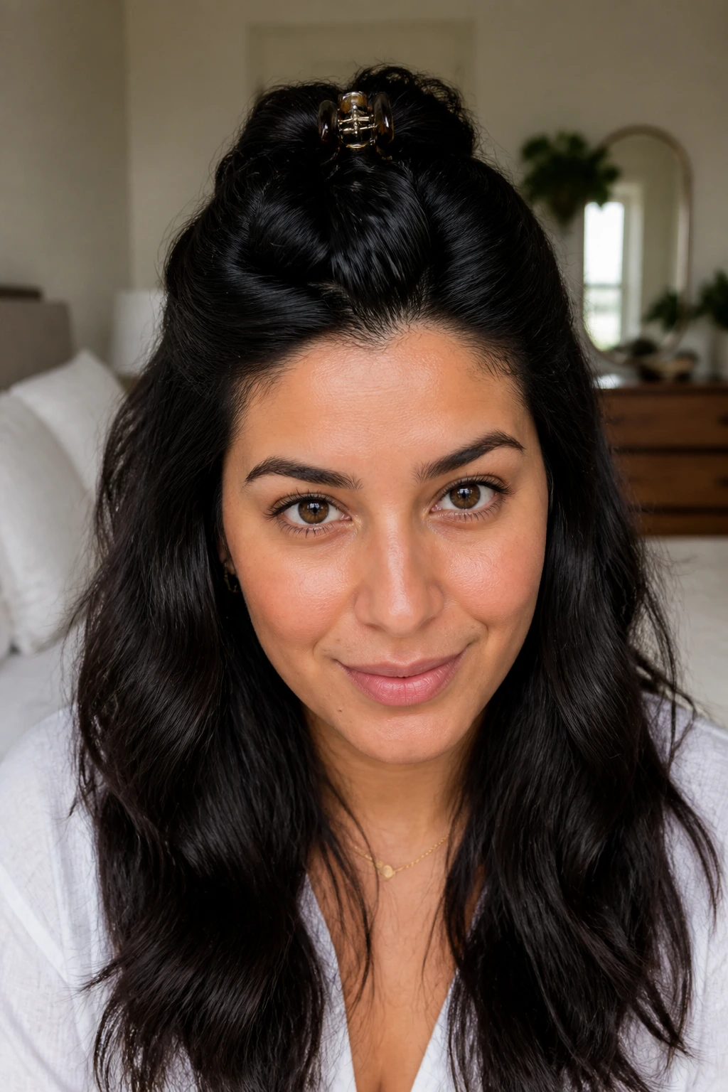 Close-up portrait of a woman with a jaw-clip half-up twist
