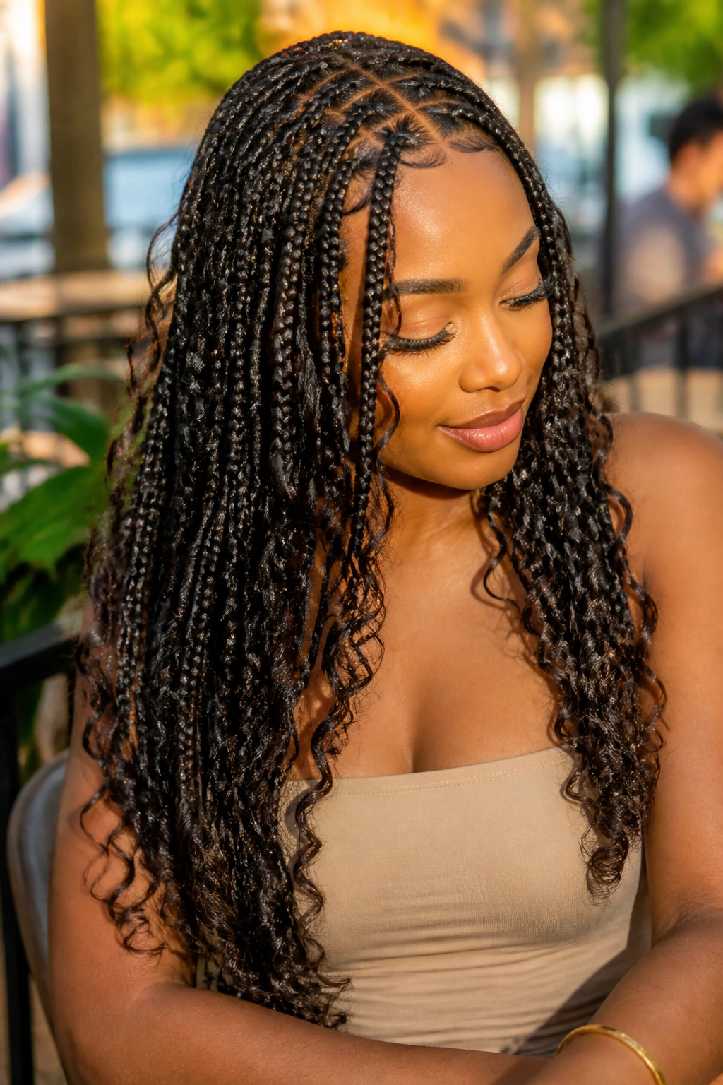 Close-up of knotless boho braids with spiral tips on a real woman