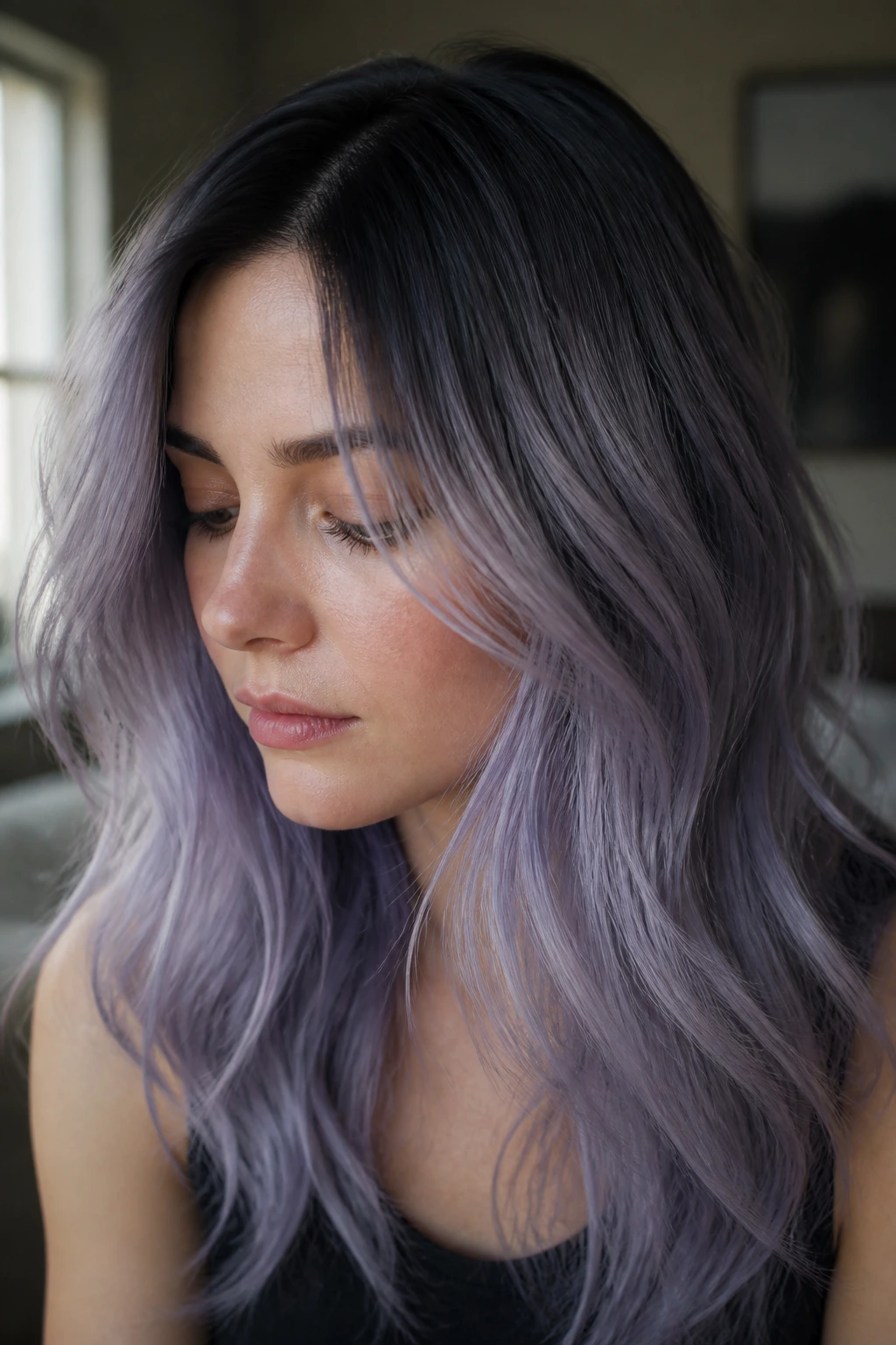 Close-up of a real woman with lavender smoke transition hair framing the face