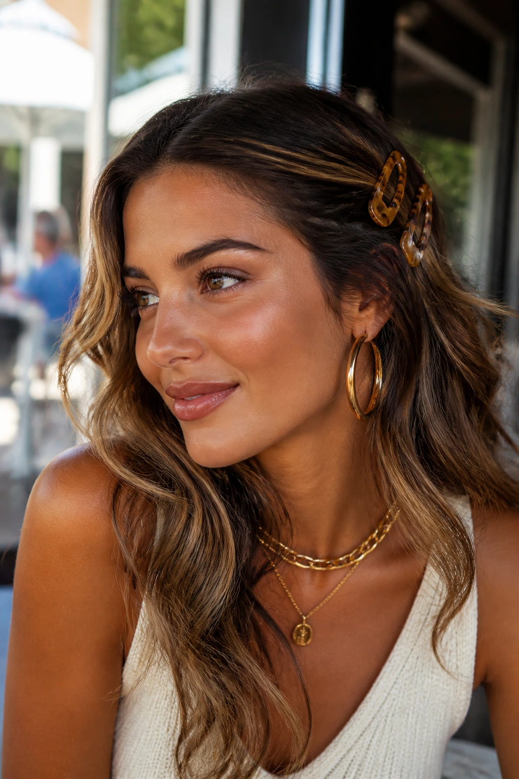 Portrait showing makeup and warm-toned accessories with hair