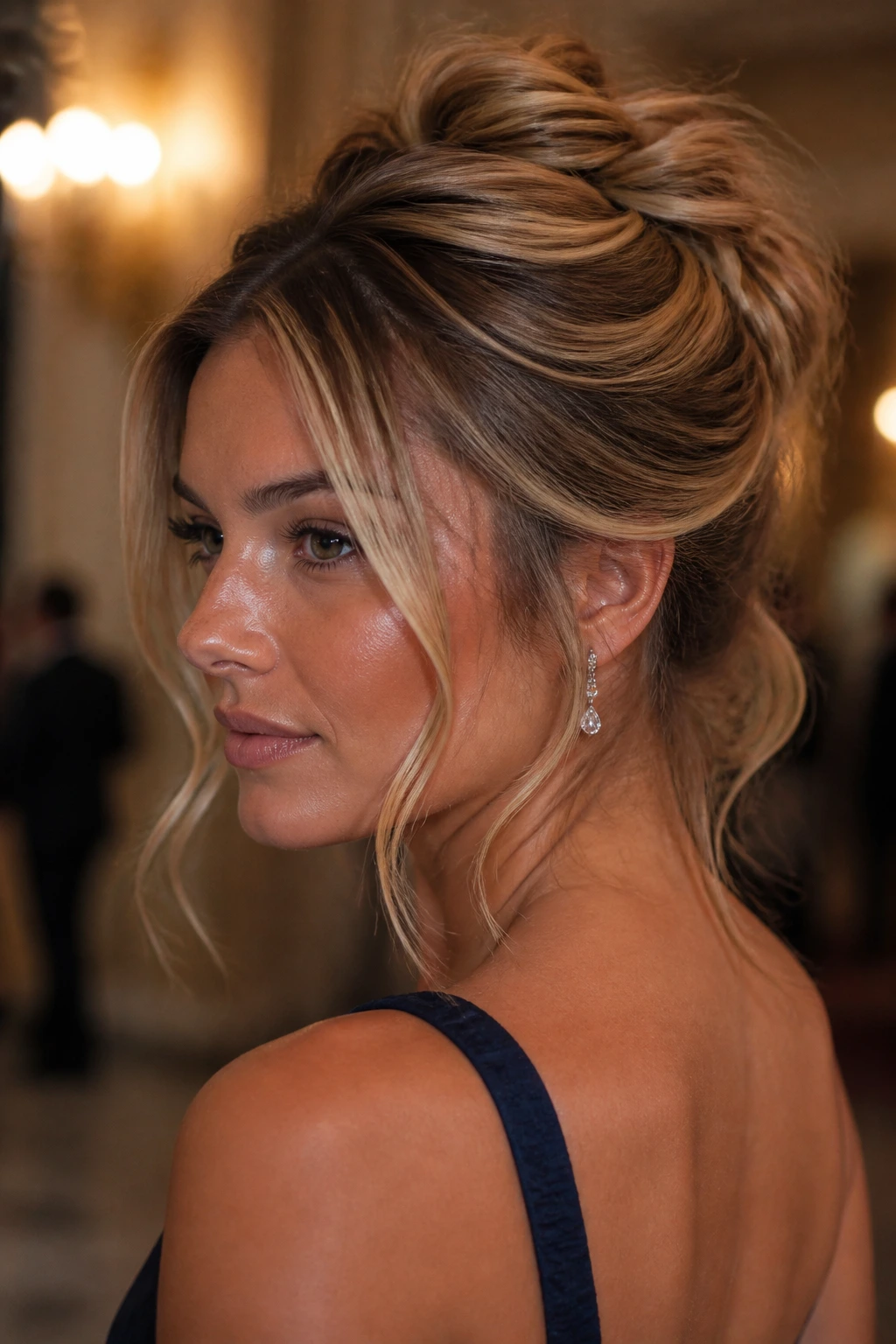 Close-up of a real woman with a messy shell twist and loose money pieces