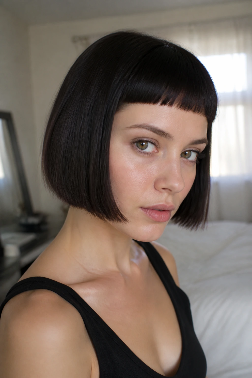 Close-up of a real woman with micro fringe bob in soft window light