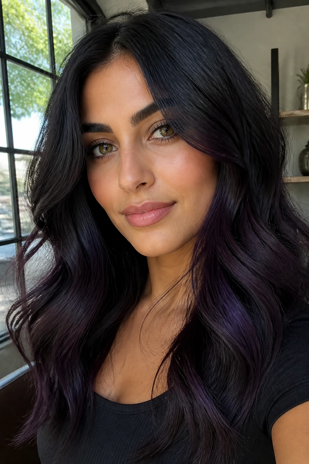 Close-up portrait of a real person with midnight black hair and violet smoke tones on olive skin
