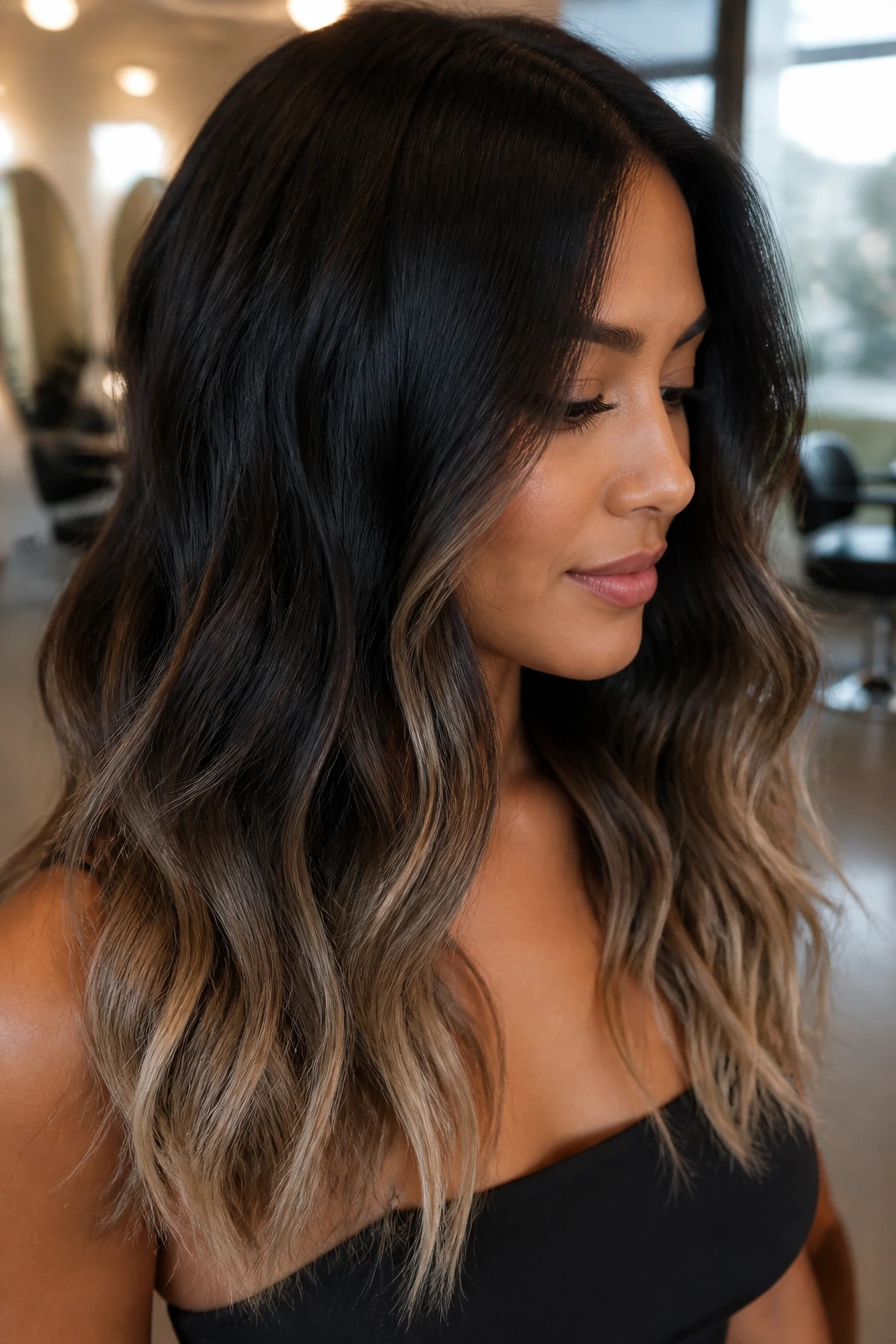 Close-up of a real person with midnight brown hair and beige tips on tan skin