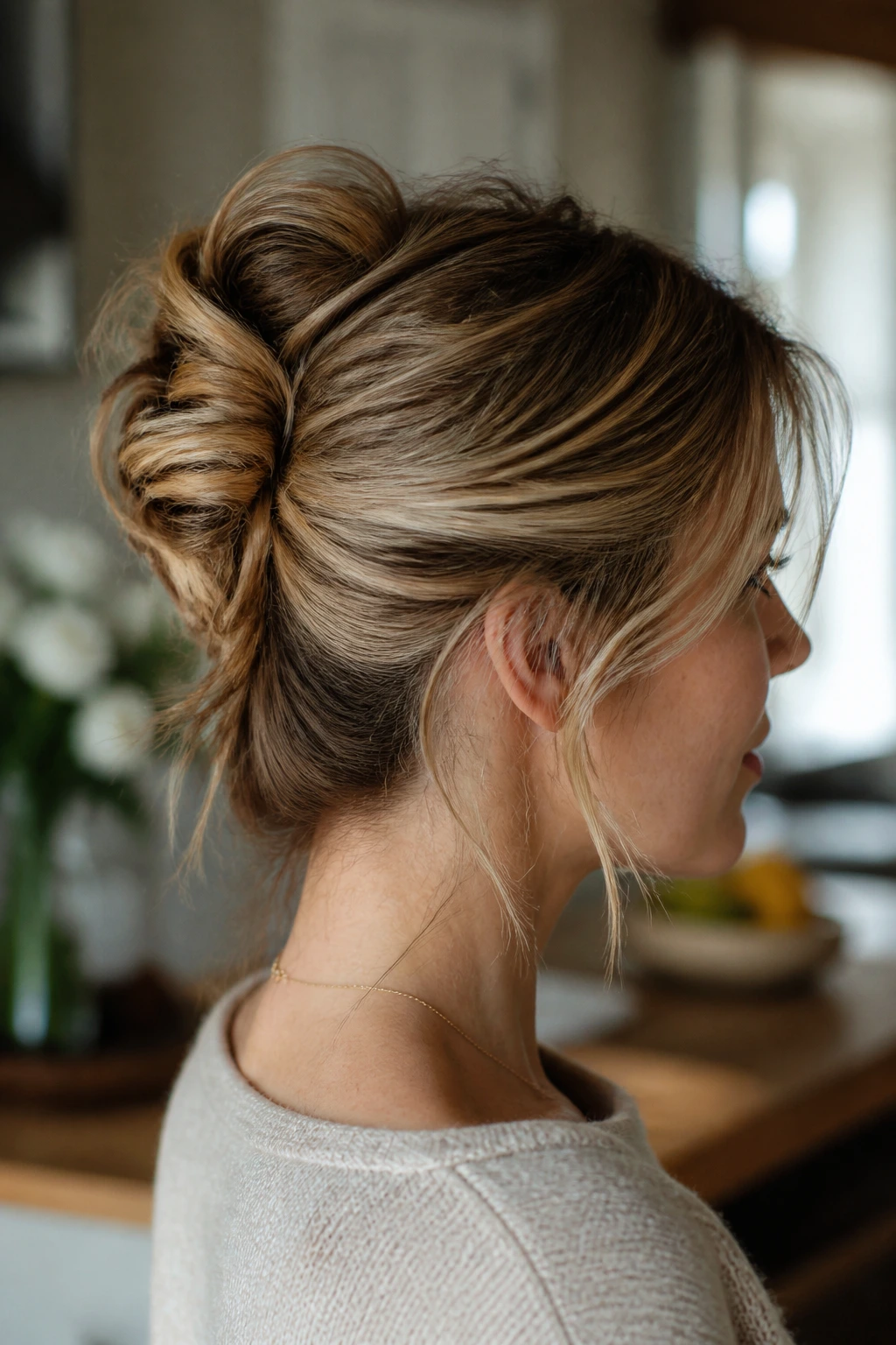 Close-up of a real woman with a mini French twist at the back