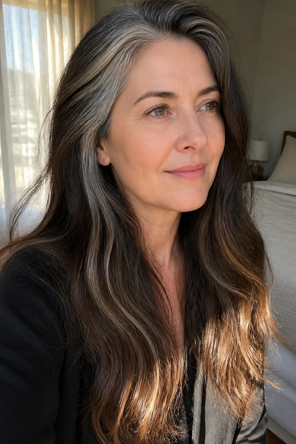 Portrait of a person with Misty Brunette length and temple silver streaks