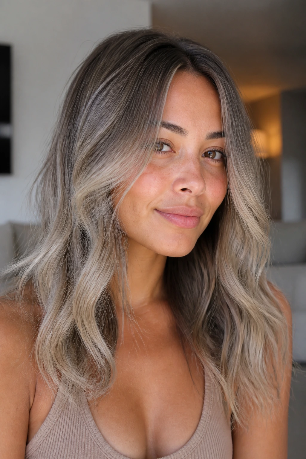 Mushroom blonde ombre on olive skin in close-up portrait