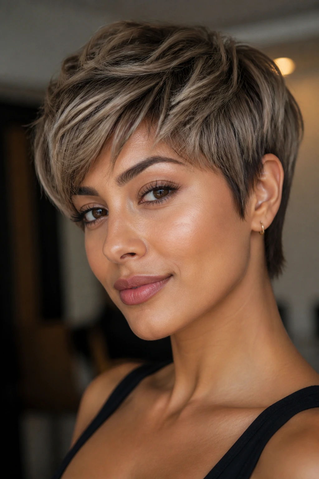 Pixie cut in mushroom blonde with olive-friendly cool tones on a real person