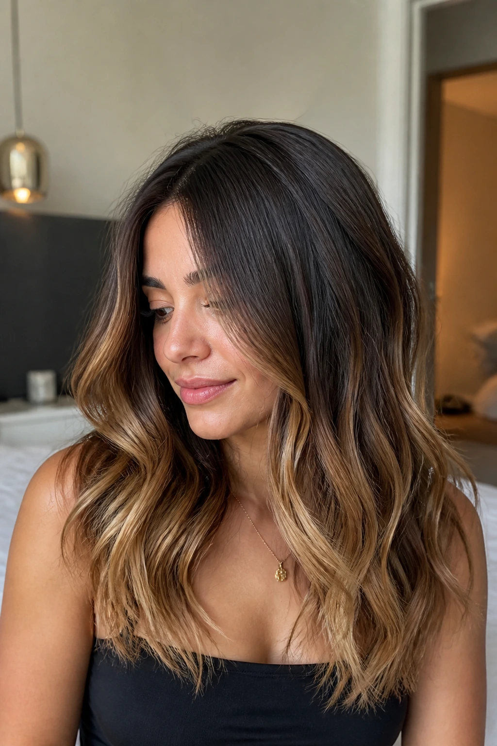 Brunette with mushroom brown to caramel fade in a close-up portrait