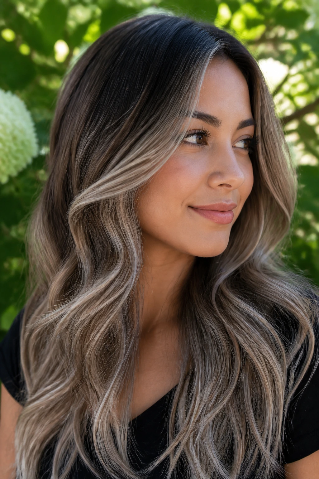 Long hair with ash-beige mushroom highlights in sunlit garden