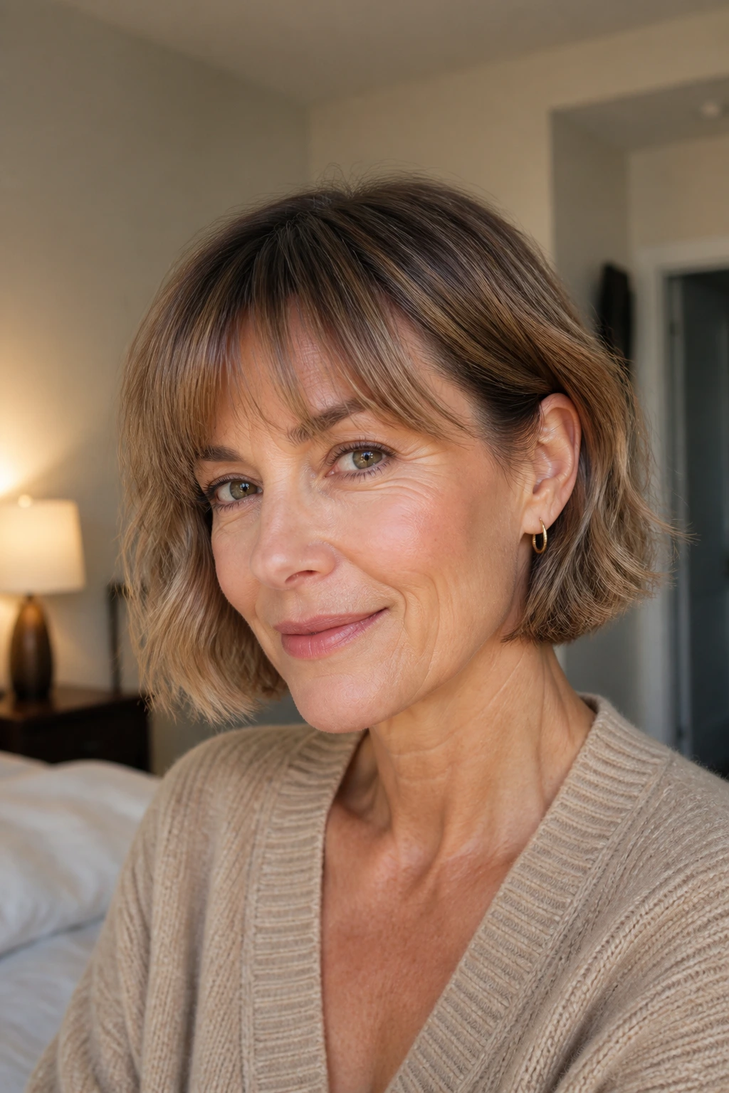 Close-up portrait of a real woman with a neck-grazing bob and tapered bangs