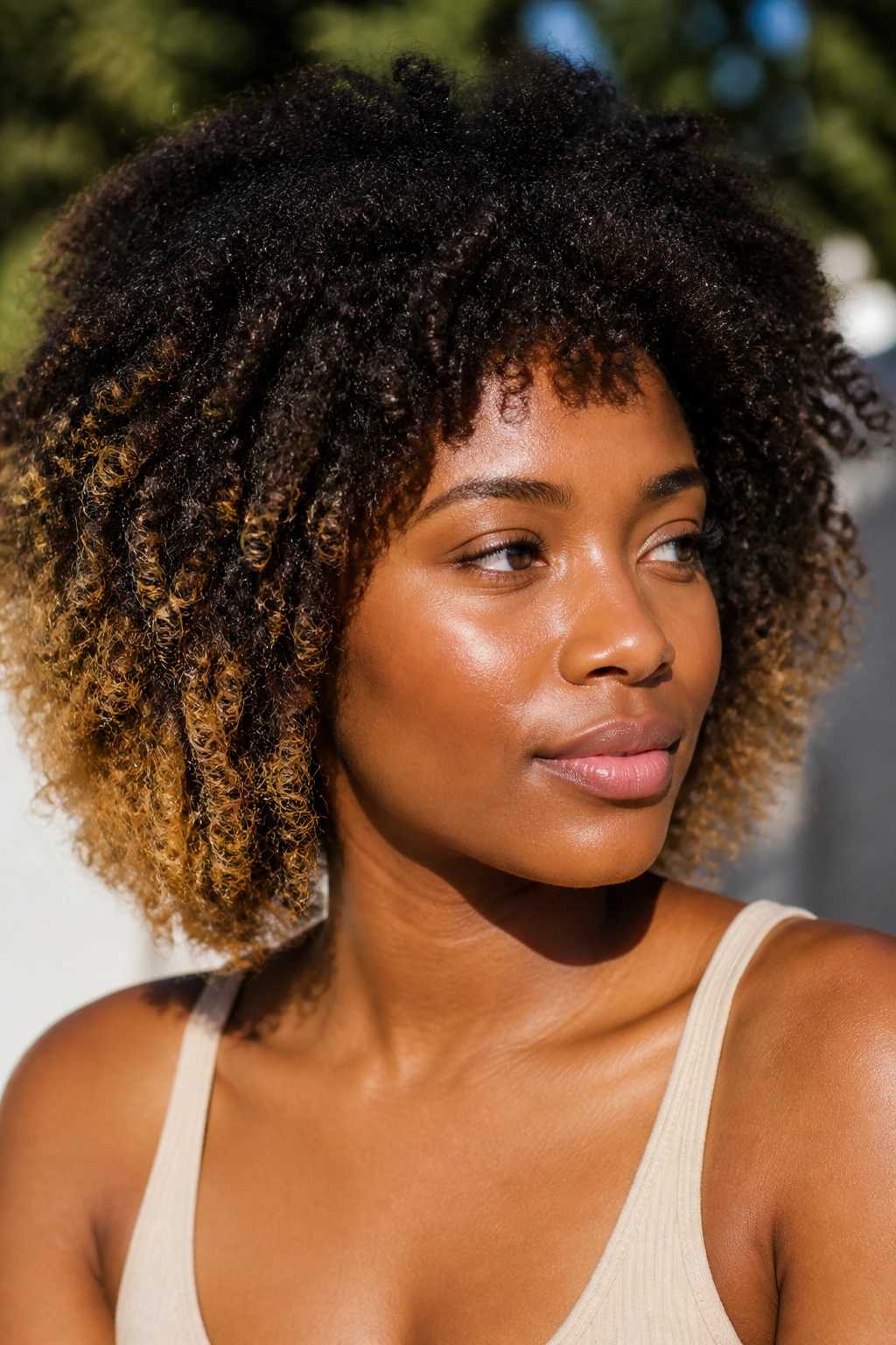 Ombré ends on dark base hair with sun-kissed tips in natural light