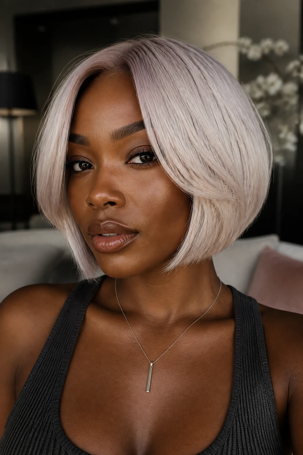 Pearl platinum bob on deep skin model with violet-beige tint