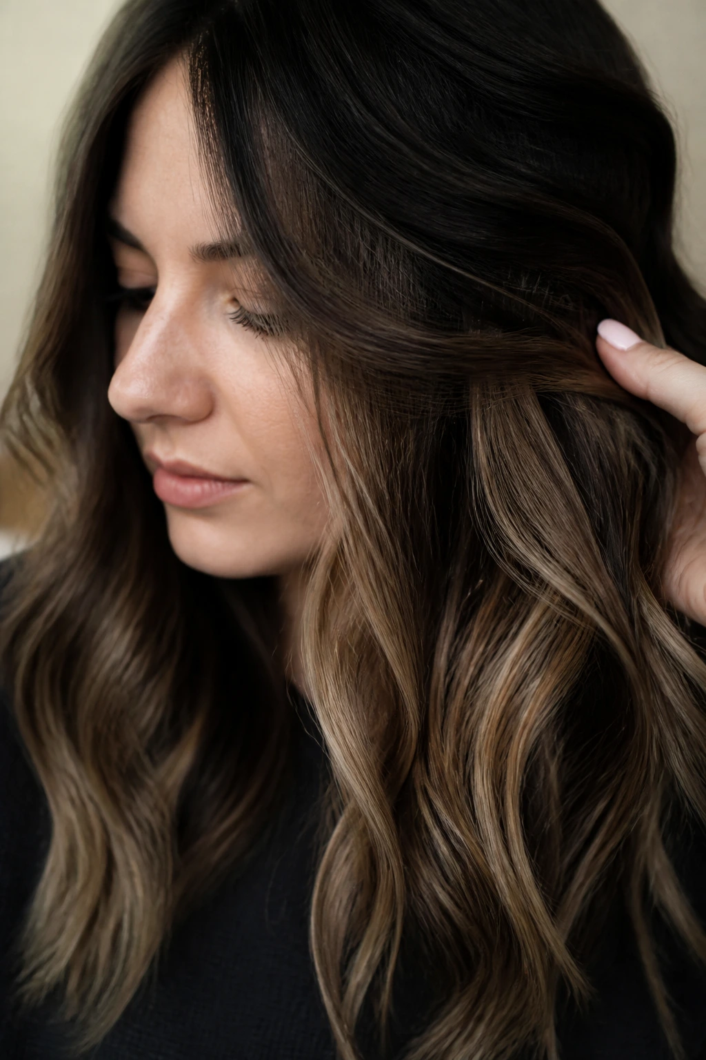 Portrait of person showing hidden peekaboo caramel under darker crown