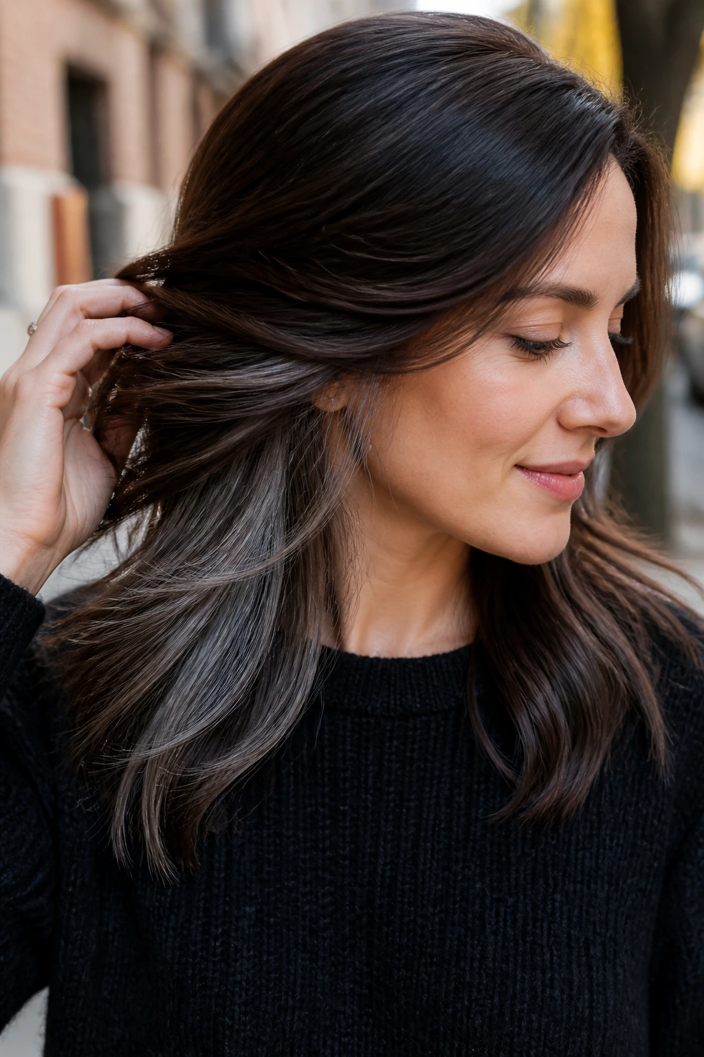 Brunette showing titanium peekaboo panels under top layer