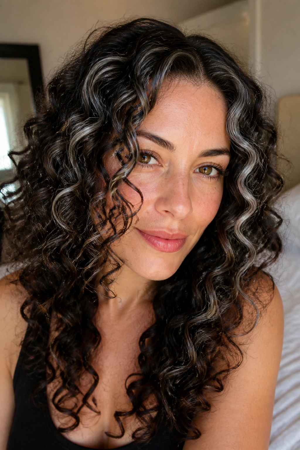 Close-up of brunette with pewter ringlet accents around the crown