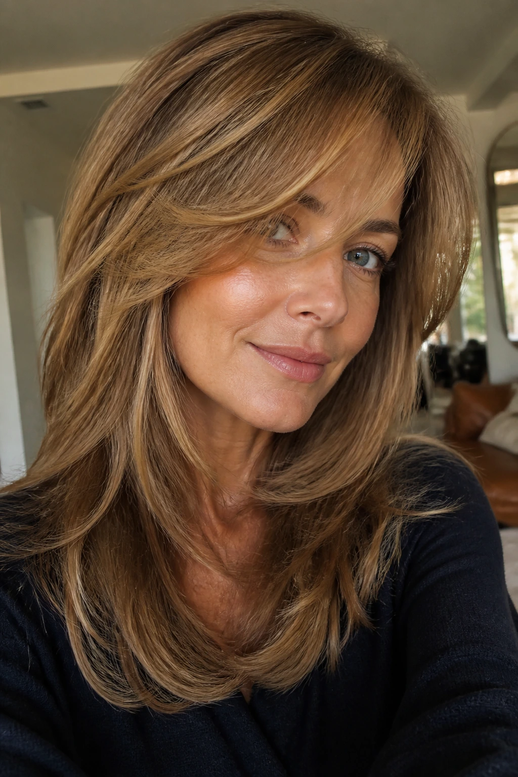 Close-up portrait of a woman with chin-face framing layers and a side-swept fringe