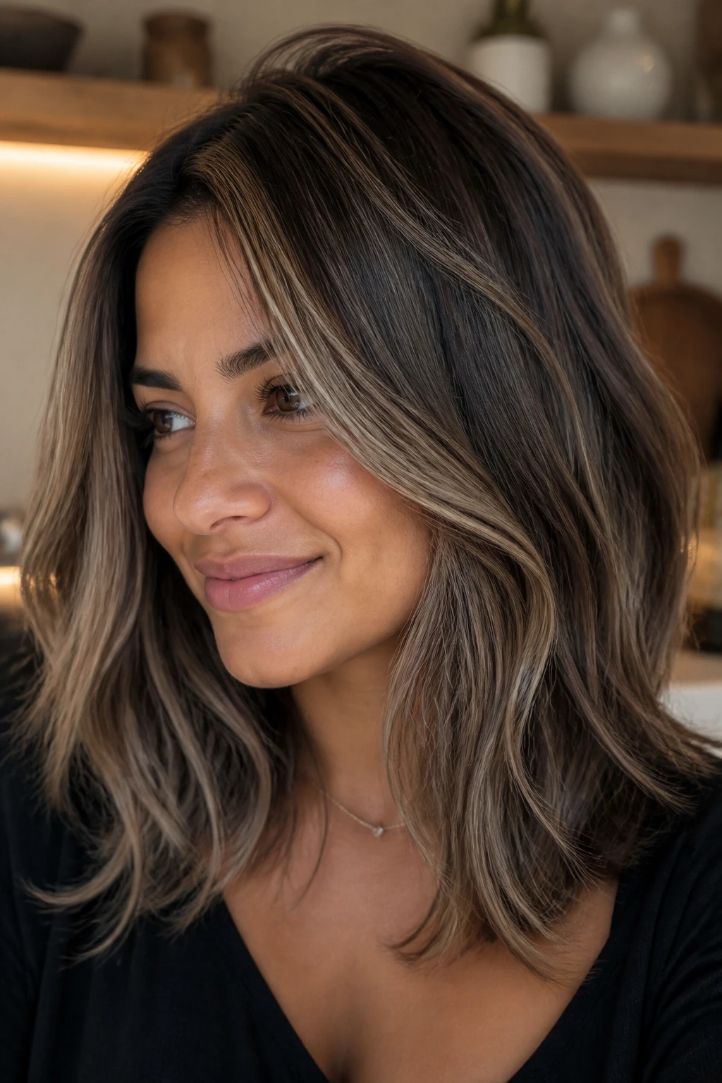 Razor-soft midi hairstyle with smoke-tea babylights on real person