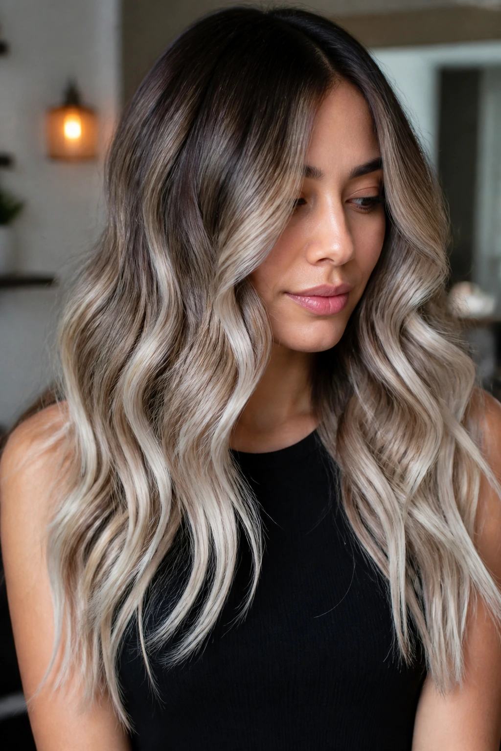 Brunette with long waves and rooted silver beige