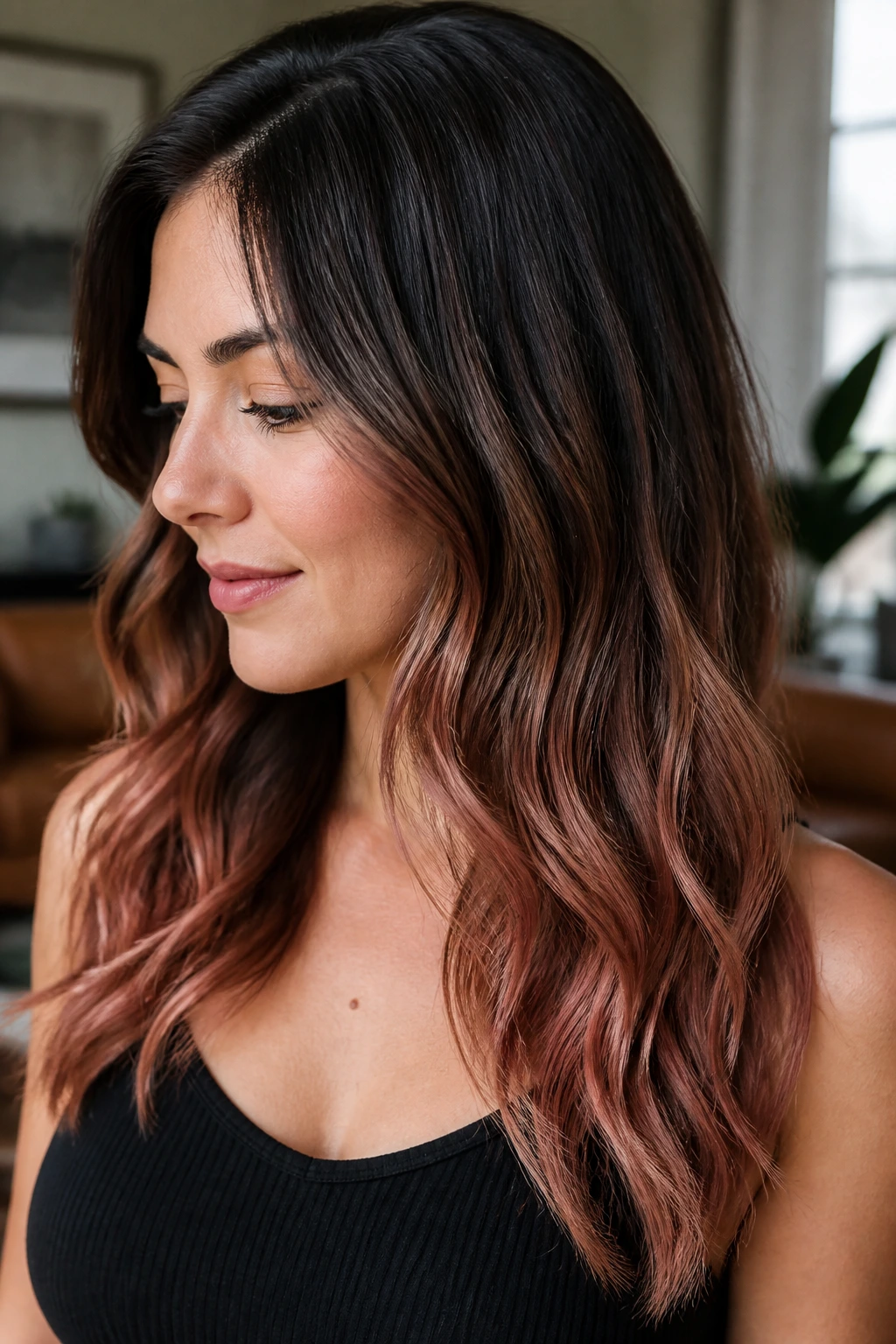 Close-up of rose-gold balayage ends on brunette hair