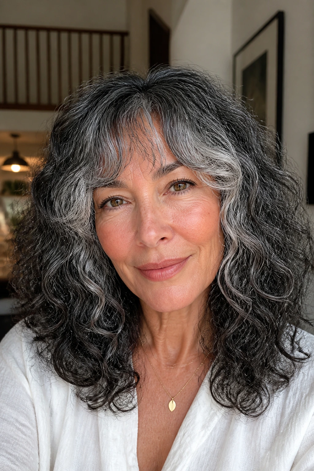 Close-up of salt-and-pepper face-framing fringe on a real person