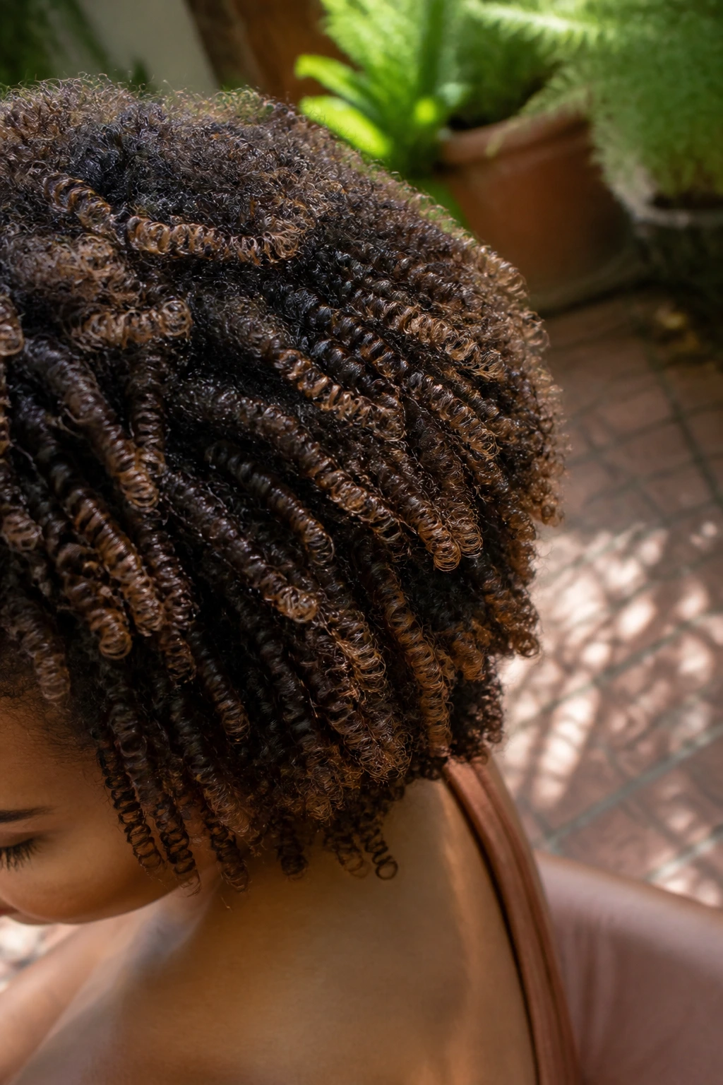 Close-up coil pattern with sanded caramel color inside the curl