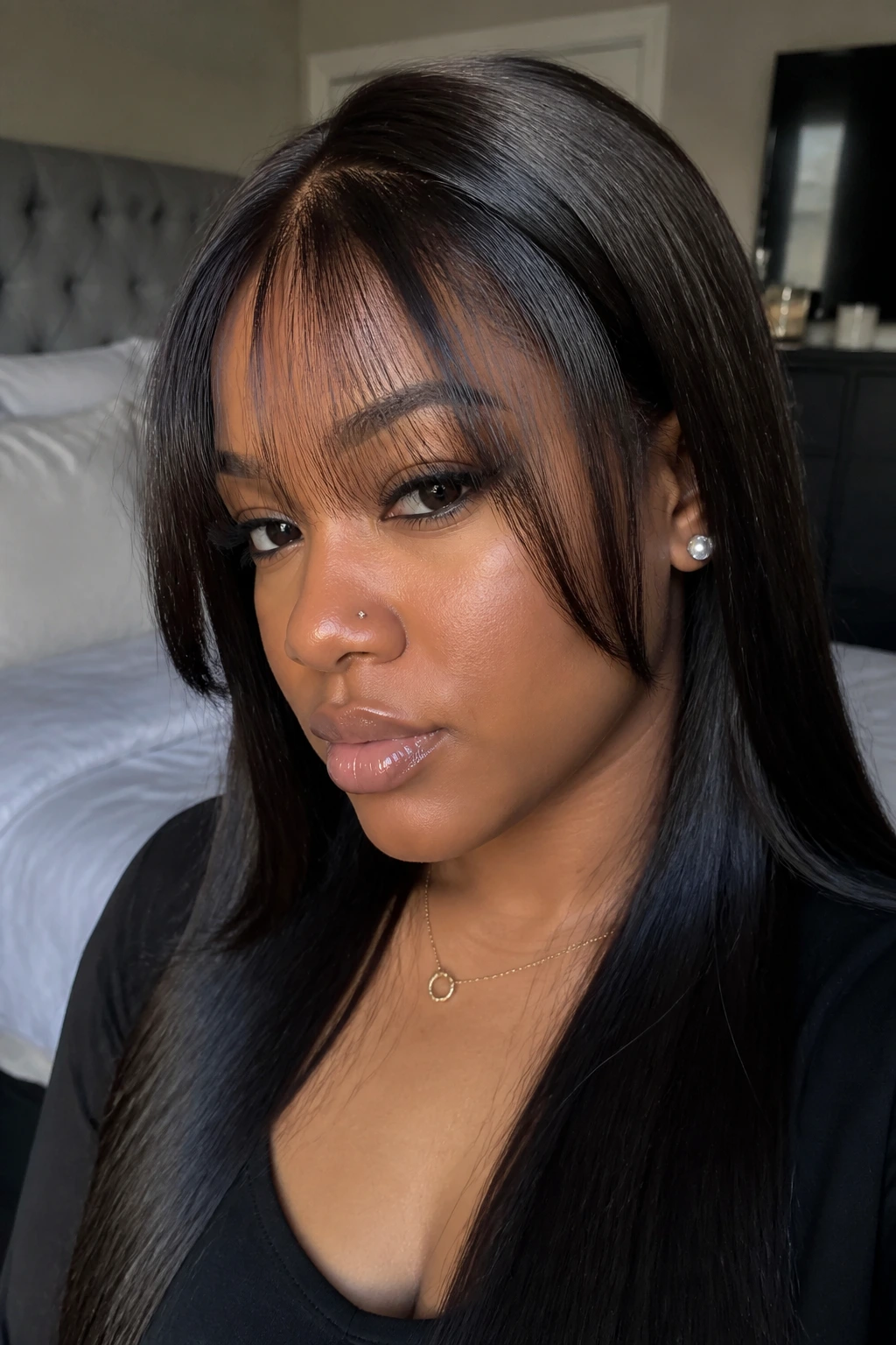 Real woman with sew-in bangs and leave-out.