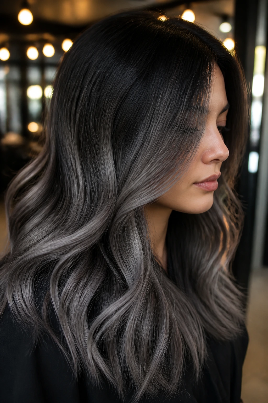 Close-up of real person with shadow root grey ombré hair on brunette base.