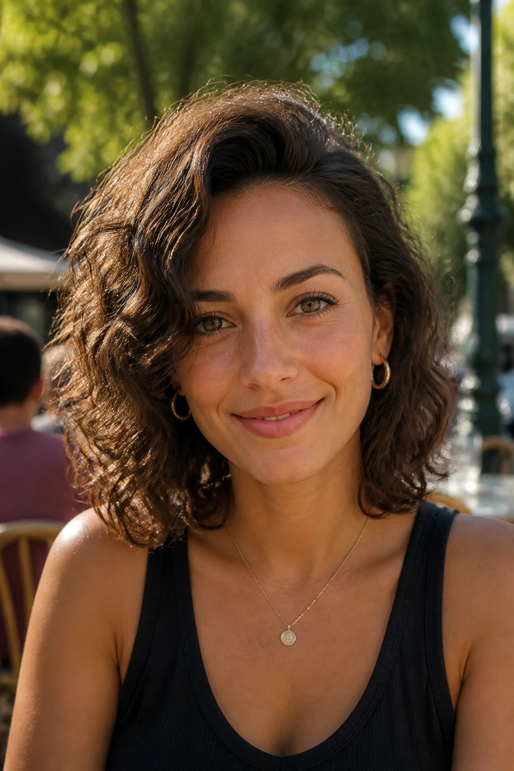 Close-up portrait of a woman with a deep side-part curly lob