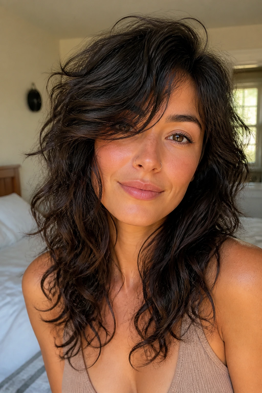 Close-up portrait of a real woman with Side-Swept Fringe Shag featuring a deep side fringe framing the cheek