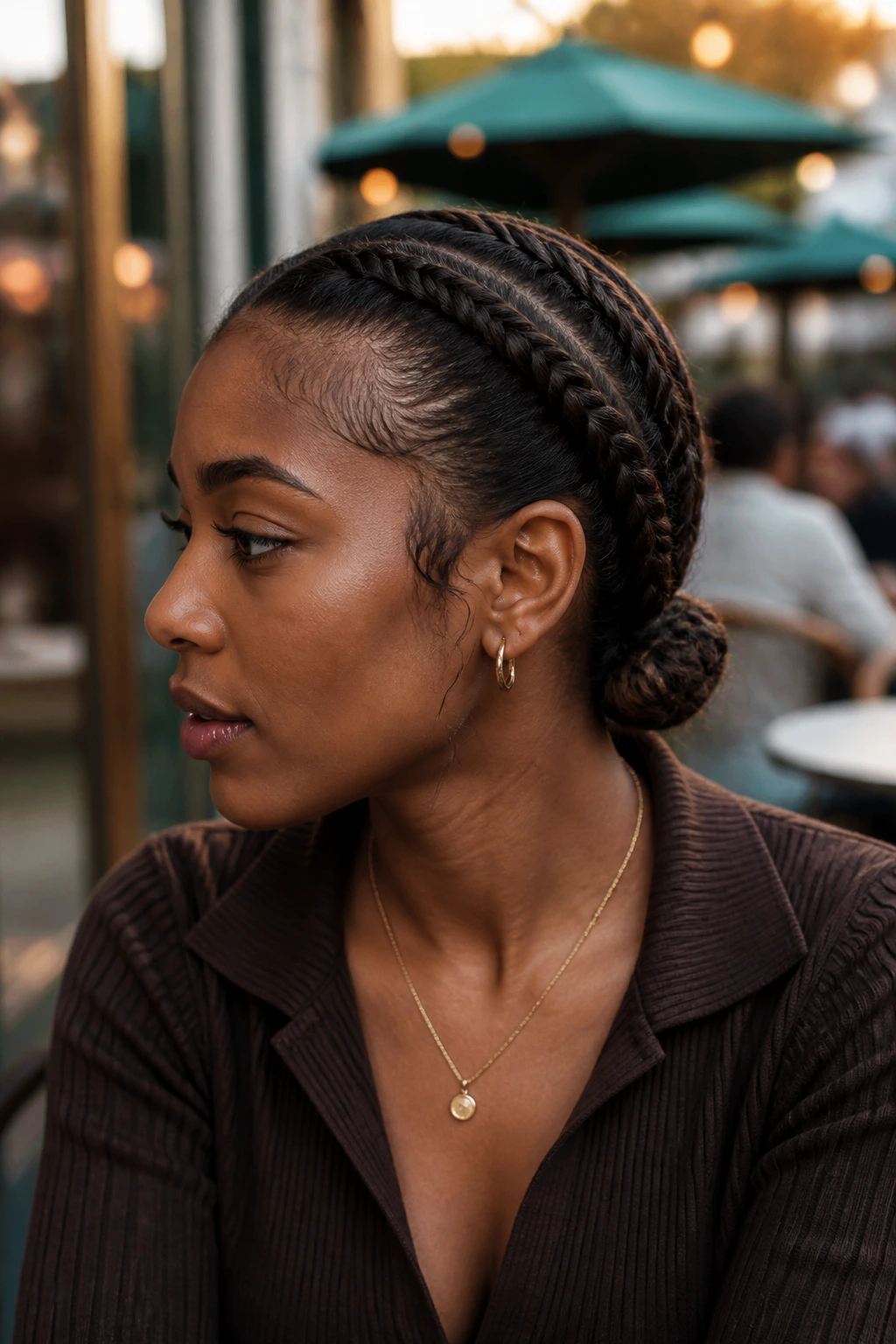 Close-up of side-swept low-nape double Dutch braids on a real woman