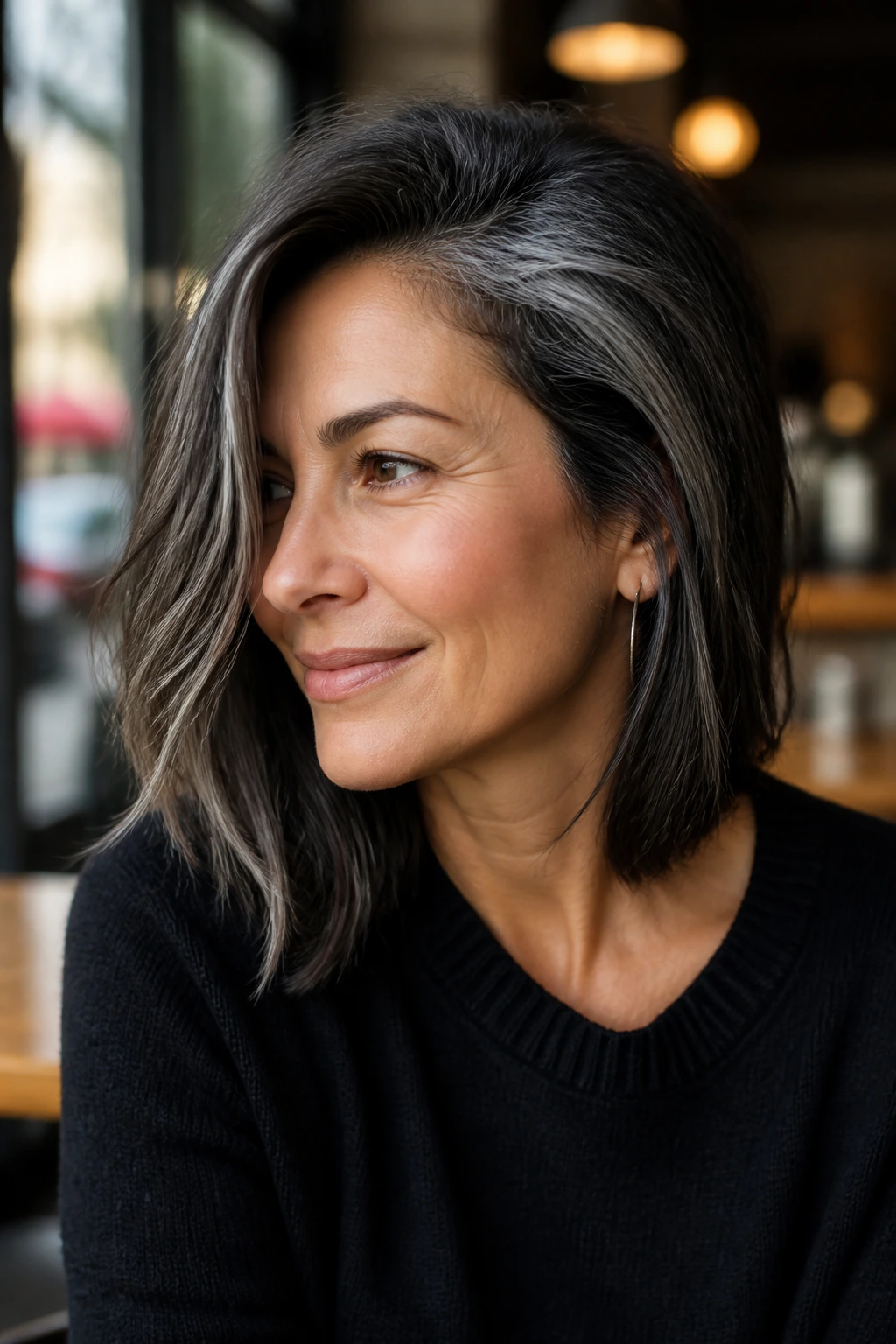 Portrait of a real person with side-swept medium cut showing temple gray