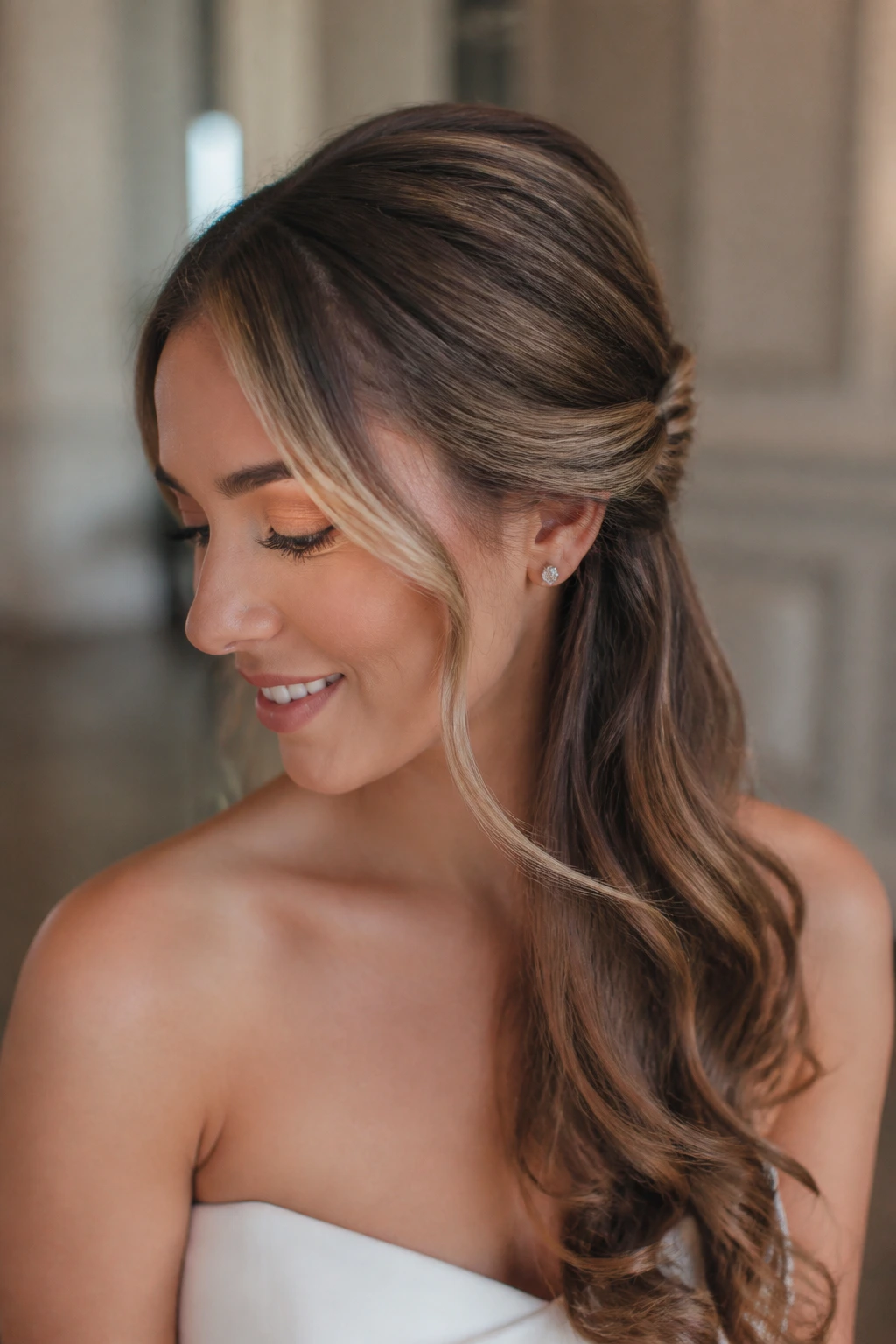 Bride with side-swept twist anchored behind the ear.