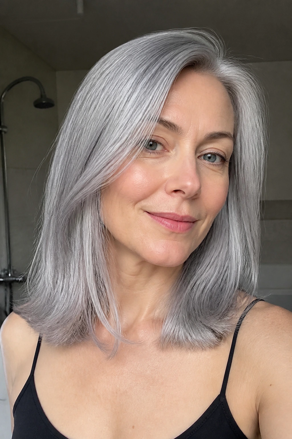 Close-up real person with metallic grey hair looking glossy and healthy between salon visits