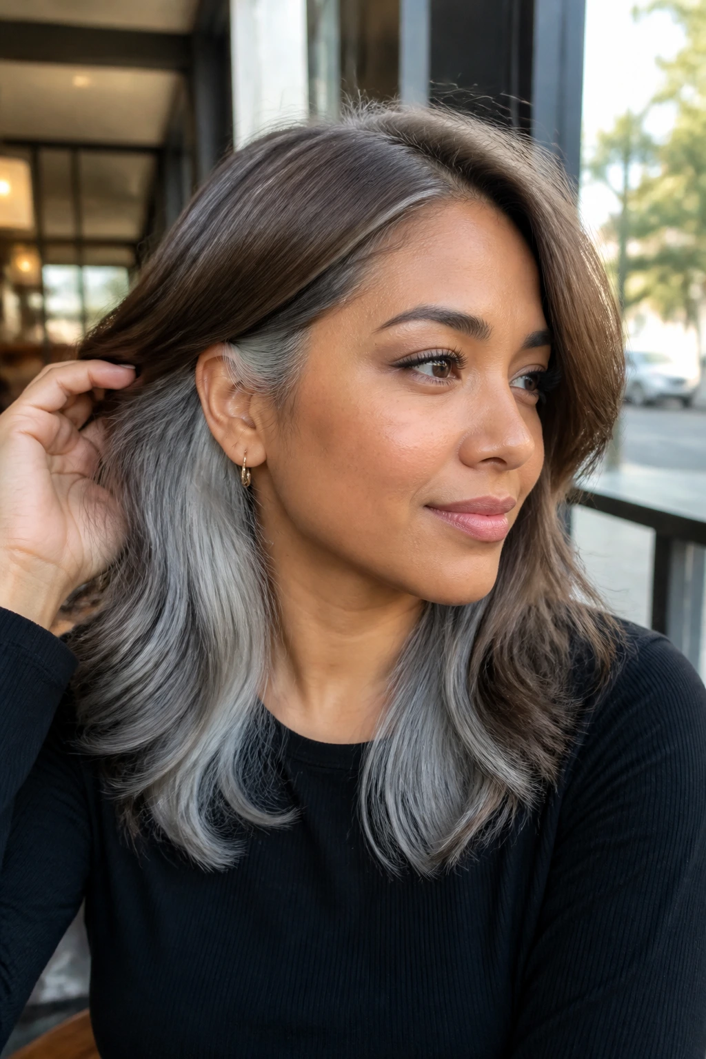 Close-up of a real woman with Silver Smoke Underlights peeking from beneath the top layer.