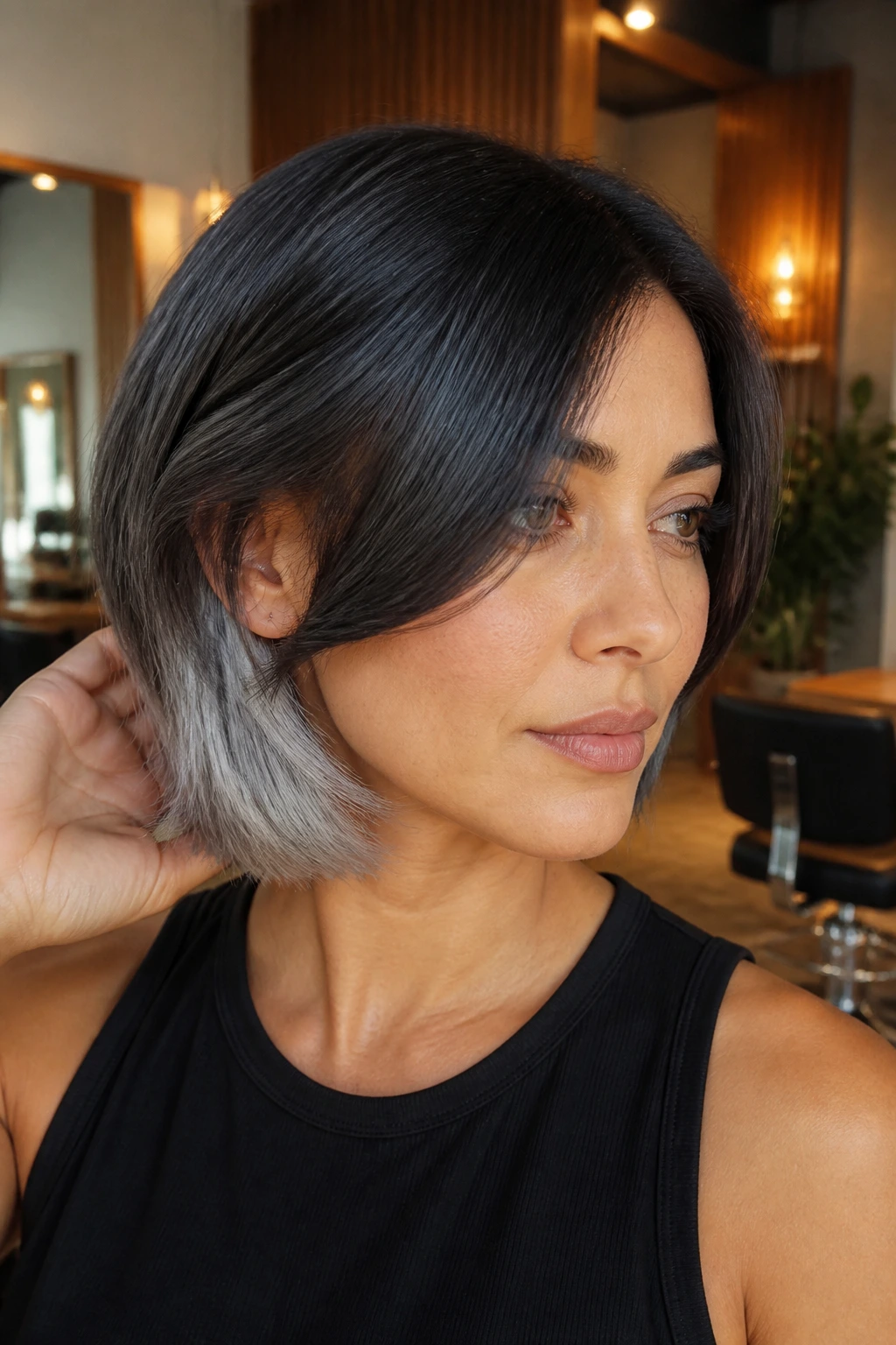Close-up of a real woman's bob with silver underlayer catching light